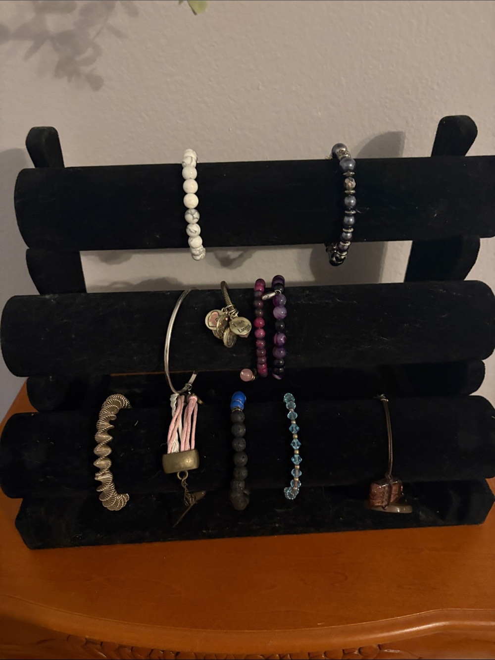 Variety of bracelets and bracelet holder is included!